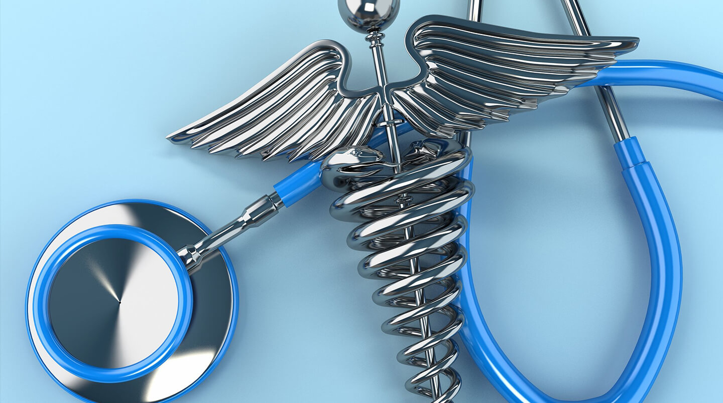 A stethoscope and a medical symbol on a blue background.